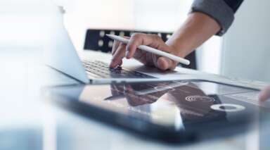 operating model design hand laptop