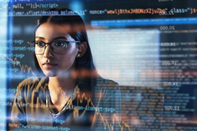 technology and data woman at screen